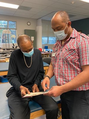 A Vietnam veteran receives his lapel pin.