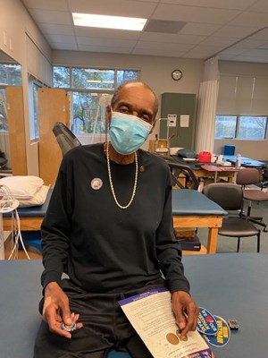 A Vietnam veteran receives his lapel pin.