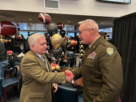 U.S. Army Maj. Gen. Ed Chrystal, Jr., shakes hands with U.S. Senator Jack Reed &#40;RI&#41;. 