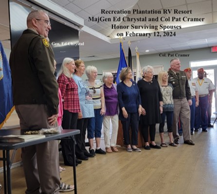 Maj. Gen. Ed Chrystal and Col. Pat Cramer honor surviving spouses. 