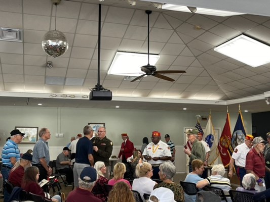Director Chrystal pins a Vietnam veteran.