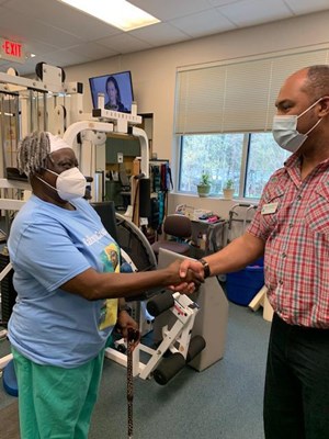 A Vietnam veteran receives her lapel pin.