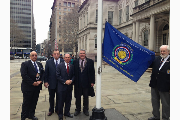 Mayor Michael Bloomberg flies the Vietnam War Commemoration flag at New York City Hall.  Bloomberg i