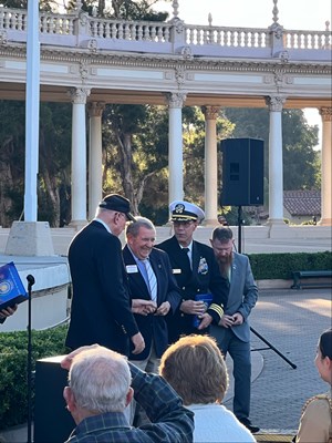 Photo of Cmdr. Brian Wierzbicki, U.S. Navy, and Chief, Public Engagement prior to presenting a VVLP.