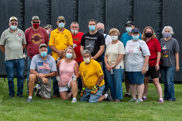 Group photo of volunteers and staff who assembled The Wall That Heals exhibi