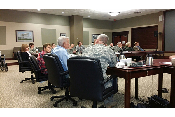 Lt. Col. Clark Welch (U.S. Army retired, center) talks in a community forum at Fort Leavenworth, Kan