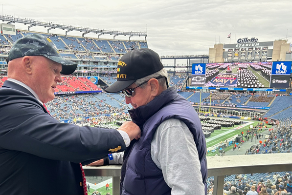VWC Senior Consultant Kevin Wensing pins a Vietnam veteran.