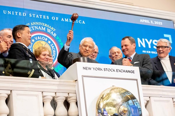 retired Commander Everett Alvarez, Jr., U.S. Navy, as he rings the closing bell