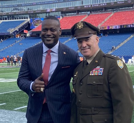 U.S. Army Maj. Gen. Ed Chrystal, Jr., stands beside CBS Sports broadcaster Kevin Carter. 