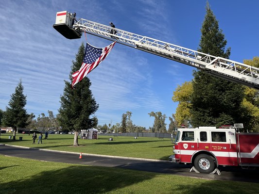 Merced Fire / Rescue Ladder Truck 85 raised the American Flag before the opening ceremony of the eve