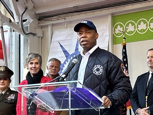 NYC Mayor Eric Adams speaks to parade attendees.