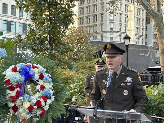 Military leaders speak during the event.