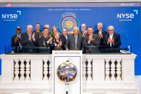retired Commander Everett Alvarez, Jr., U.S. Navy, as he rings the closing bell