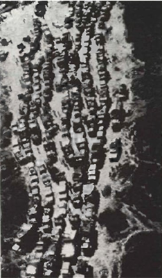 Thousands of civilian and military vehicles, targets/or shelling, clog Interprovincial Route 7B near