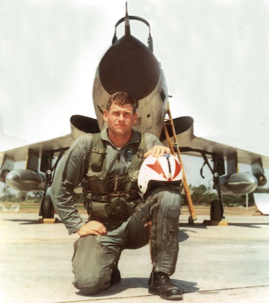 Photo of 1st Lieutenant  Adams posing in front of his F-105 Thunderchief.