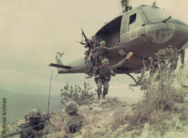 Members of the 1st Cavalry Division  (Airmobile) land on a hilltop in early 1967, preparing to make the area safe for Task Force OREGON to build a new base facility. (National Archives)