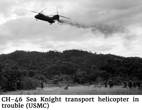 Photo of a CH-46 Sea Knight transport helicopter in trouble (USMC)