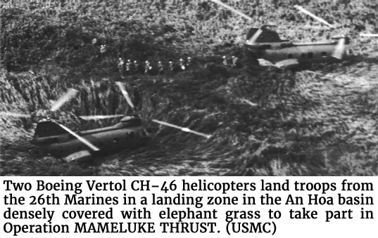 Photo of two Boeing Vertol CH–46 helicopters land troops from the 26th Marines in a landing zone in the An Hoa basin densely covered with elephant grass to take part in Operation MAMELUKE THRUST. (USMC)
