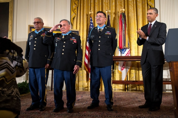 Specialist Four Santiago Erevia (right), alongside Jose Rodela and Melvin Morris, receives the Medal of Honor from President Barack Obama at the White House, March 18, 2014. (White House)