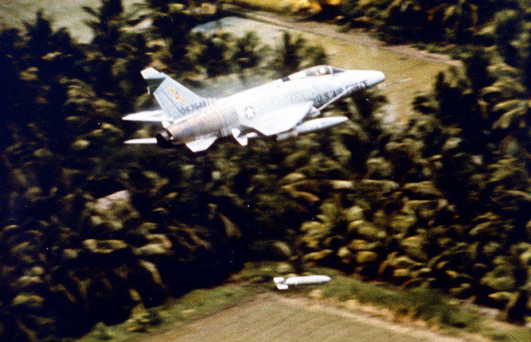 F-100 Super Saber releasing a bomb over the Mekong Delta, unkown date. Major Geirge Smith was flying an F-100 when he was shot down on April 3, 1965.