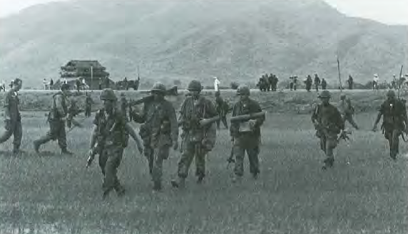 Photo provided by the U.S. Army of Troops of the 1st Brigade, 101st Airborne Division, during HIGHLAND, with Highway 19 in the background, 1965.