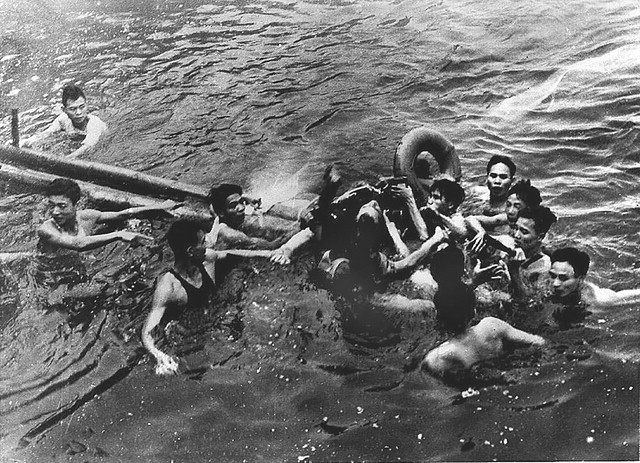 John McCain is pulled from a Hanoi lake by Vietnamese civilians