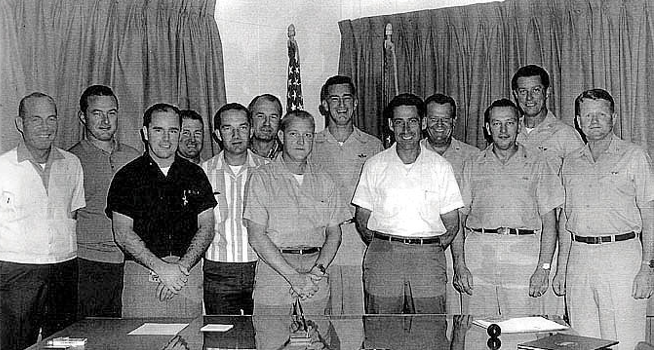 Lockheed A-12 test pilots and managers, photographed circa 1963. Jack Weeks is fifth from the left in the striped shirt. (Central Intelligence Agency)