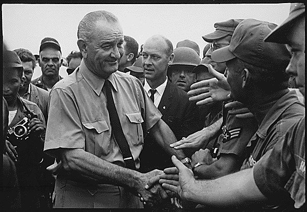 President Lyndon Johnson greets U.S. troops in Vietnam during a presidential trip to Asia, circa October 1966. (National Archives)