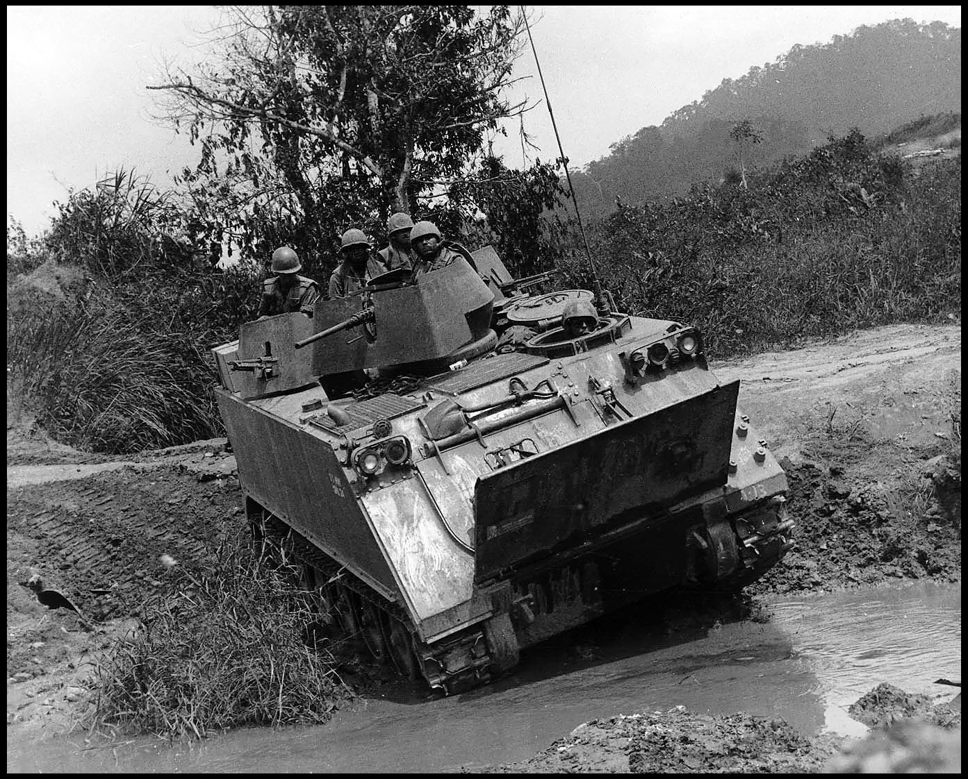 Photo of an M-113 Armored Personnel Carrier on the move in Vietnam, circa 1966. (U.S. Army)