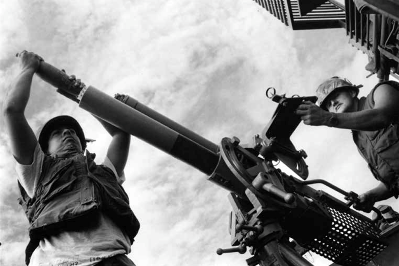 Two sailors man an 81-millimeter mortar aboard a monitor, May 23, 1968. (U.S. Navy)