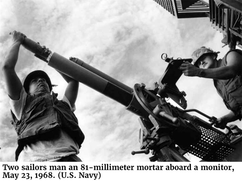 Two sailors man an 81-millimeter mortar aboard a monitor, May 23, 1968. (U.S. Navy)