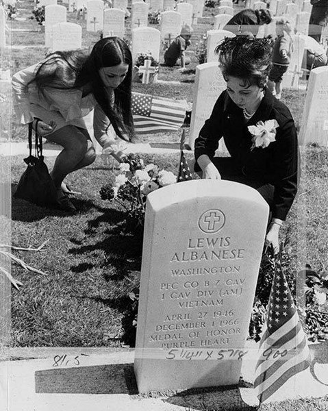 Lewis Albanese’s mother, Giannina Albanese, and sister, Rosita Albanese, visit his grave in Seattle, Washington, two months after the posthumous presentation of his Medal of Honor, May 30, 1968. (Washington Museum of History and Industry)