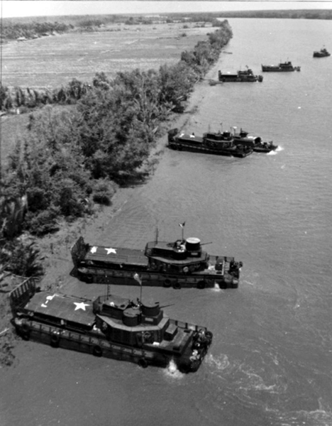 The Army-Navy team. Navy Task Force 117 armored troop carriers deliver their 9th Infantry Division troops ashore in the Mekong Delta. (USN photo)