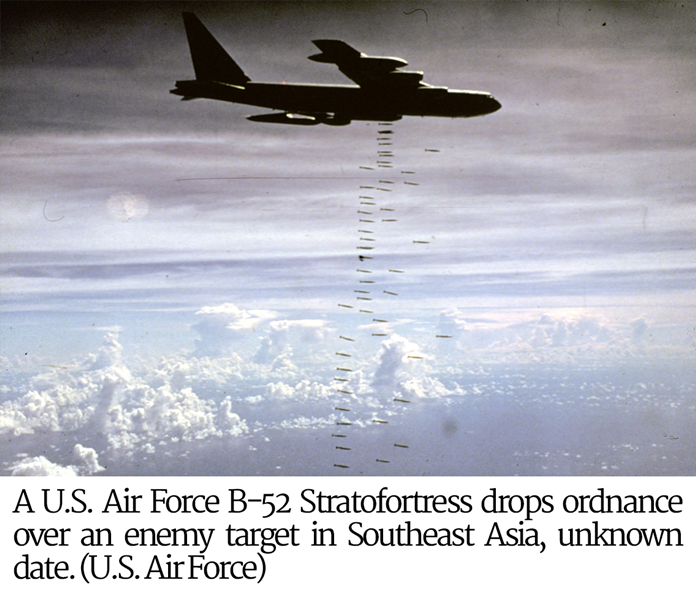 A U.S. Air Force B-52 Stratofortress drops ordnance over an enemy target in Southeast Asia