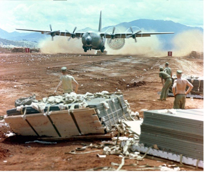 A C-130 delivers supplies to a Marine Corps base in South Vietnam, circa late 1960s. (National Museum of the U.S. Air Force)