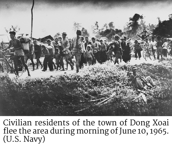 Civilian residents of the town of Dong Xoai flee the area during morning of June 10, 1965. (U.S. Navy)