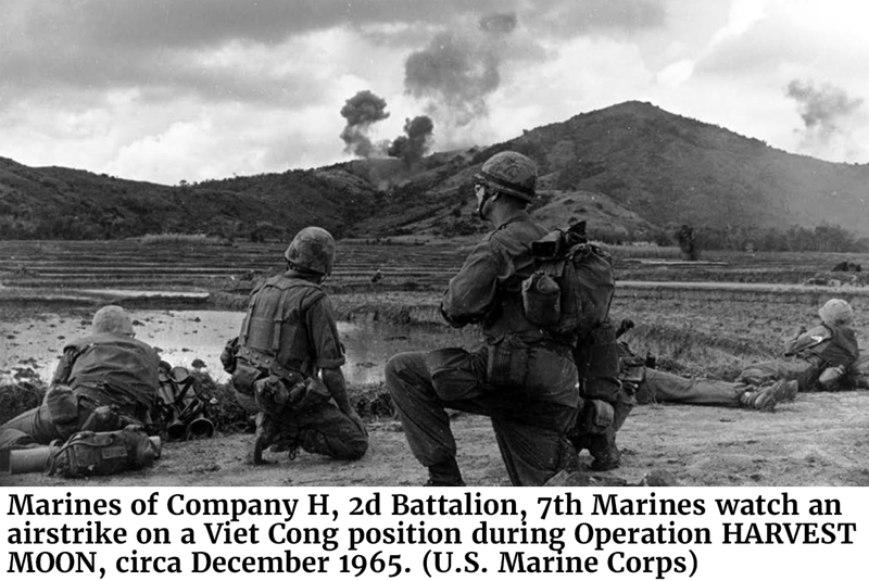 Marines of Company H, 2d Battalion, 7th Marines watch an airstrike on a Viet Cong position during Operation HARVEST MOON, circa December 1965. (U.S. Marine Corps)