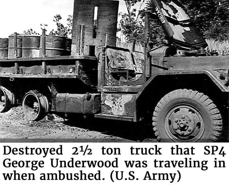 Destroyed 2½ ton truck that SP4 George Underwood was traveling in when ambushed. (U.S. Army)