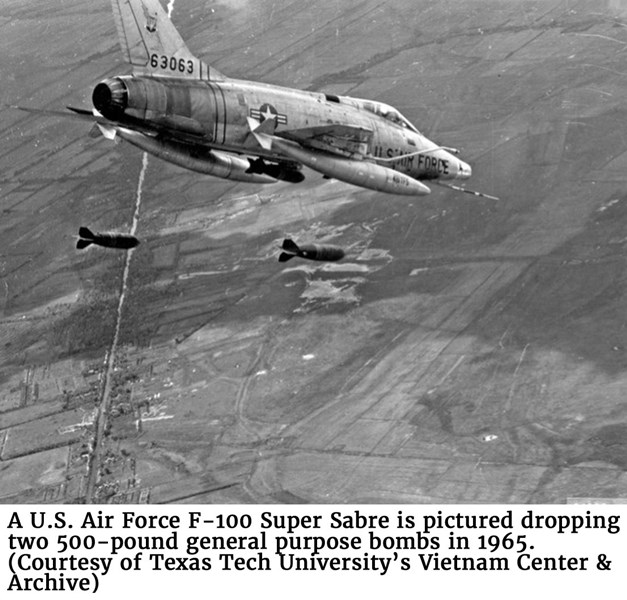 A U.S. Air Force F-100 Super Sabre is pictured dropping two 500-pound general purpose bombs in 1965. (Courtesy of Texas Tech University’s Vietnam Center & Archive) For digital file: https://www.vietnam.ttu.edu/exhibits/airforce/airforce12.php