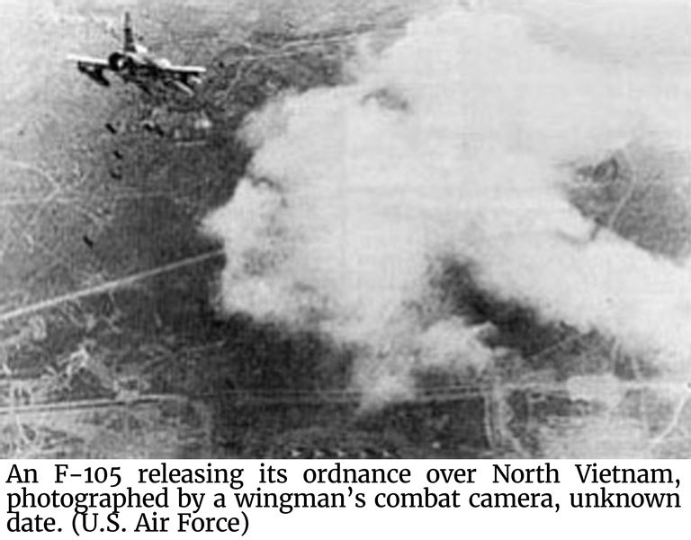 Photo of an F-105 releasing its ordnance over North Vietnam, photographed by a wingman’s combat camera.