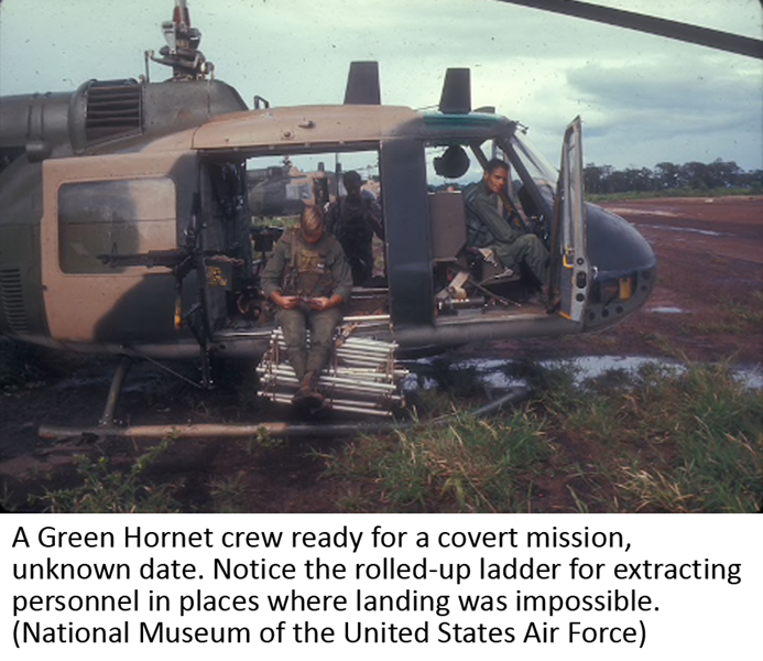 A Green Hornet crew ready for a covert mission, unknown date. Notice the rolled-up ladder for extracting personnel in places where landing was impossible. (National Museum of the United States Air Force)