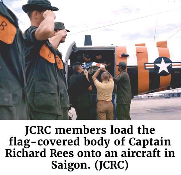 Photo of JCRC members load the flag-covered body of Captain Richard Rees onto an aircraft in Saigon. (JCRC)