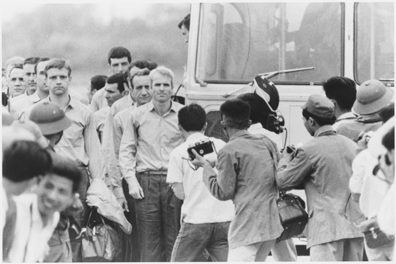 McCain waiting with his fellow ex-POWs at a Saigon airport just after their release, 1973.