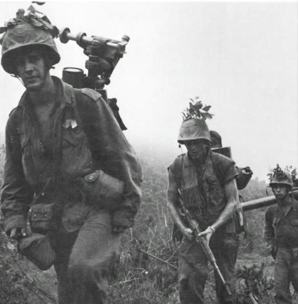 Photo of a Marine Mortar Team in January 1966 heading up a slope during DOUBLE EAGLE