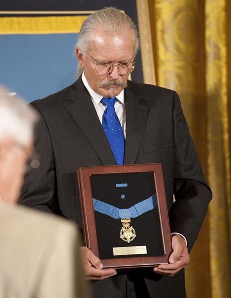 Richard Etchberger, son of the late Chief Master Sergeant Richard L. Etchberger, accepts the Medal of Honor on behalf of his father at the White House, September 21, 2010. (U.S. Department of Defense)