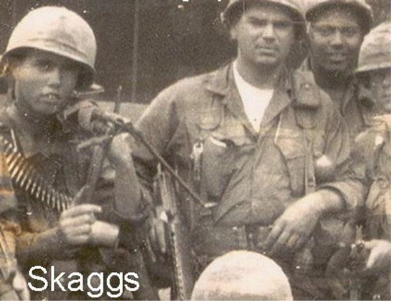 Skaggs, left, stands with members of his platoon, with his M-60 slung over his shoulder, circa early 1967. (VVMF)