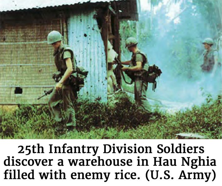 Photo provided by the U.S. Army of 25th Infantry Division Soldiers as they discover a warehouse in Hau Nghia filled with enemy rice.