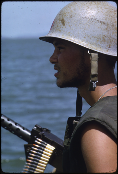 A U.S. Navy Sailor mans a .50-caliber machine gun during Operation JACKSTAY in the Rung Sat Special Zone, March 26, 1966. (National Archives)