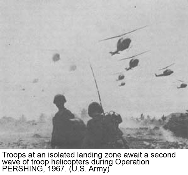 Troops at an isolated landing zone await a second wave of troop helicopters during Operation PERSHING, 1967. (U.S. Army)