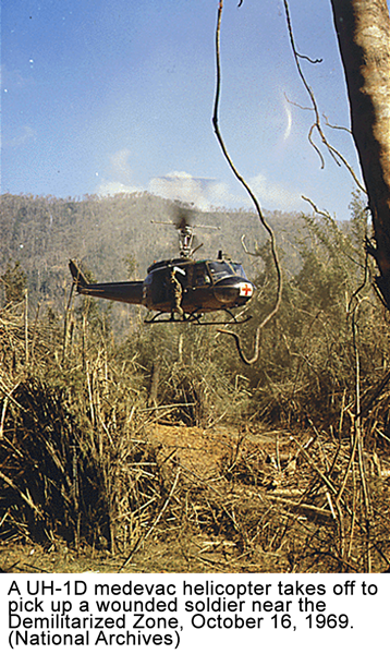   A UH-1D medevac helicopter takes off to pick up a wounded soldier near the Demilitarized Zone, October 16, 1969. (National Archives)